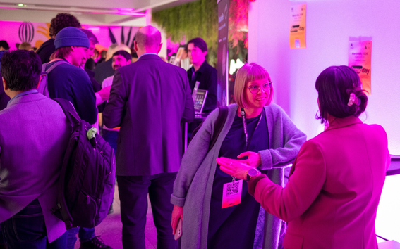 Attendees networking at Demo Day